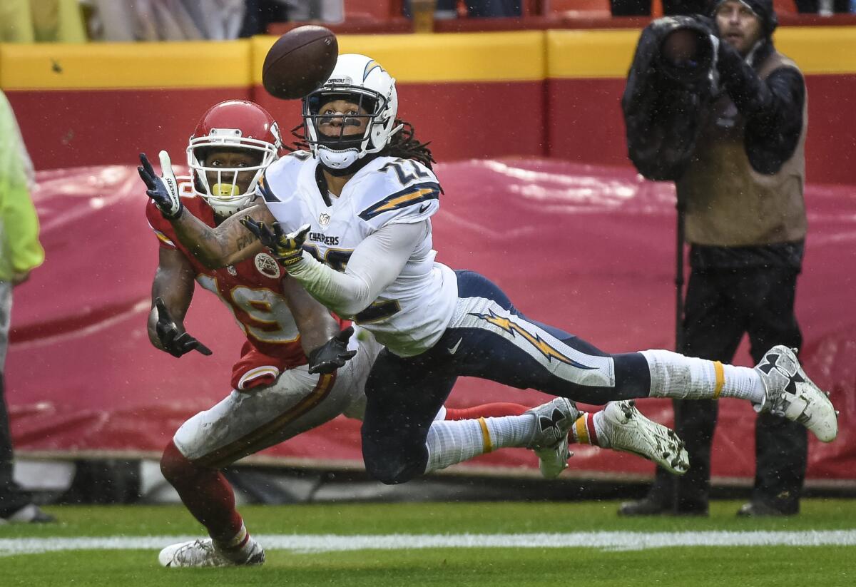 Chargers cornerback Jason Verrett intercepts a pass intended for Chiefs receiver Jeremy Maclin during the first half of a game on Dec. 13.