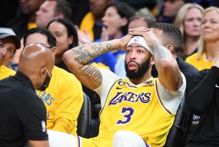 San Francisco, California May 10, 2023-Lakers Anthony Davis gets hit in the head against the Warriors.