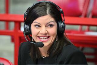 Play-by-play announcer Jenny Cavnar wears a headset before broadcasting a college basketball game.