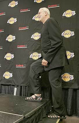 STEPPING UP: Phil Jackson, who spent a lot of his year off in Australia and New Zealand, took a casual approach to the news conference Tuesday, at least in his choice of footwear.