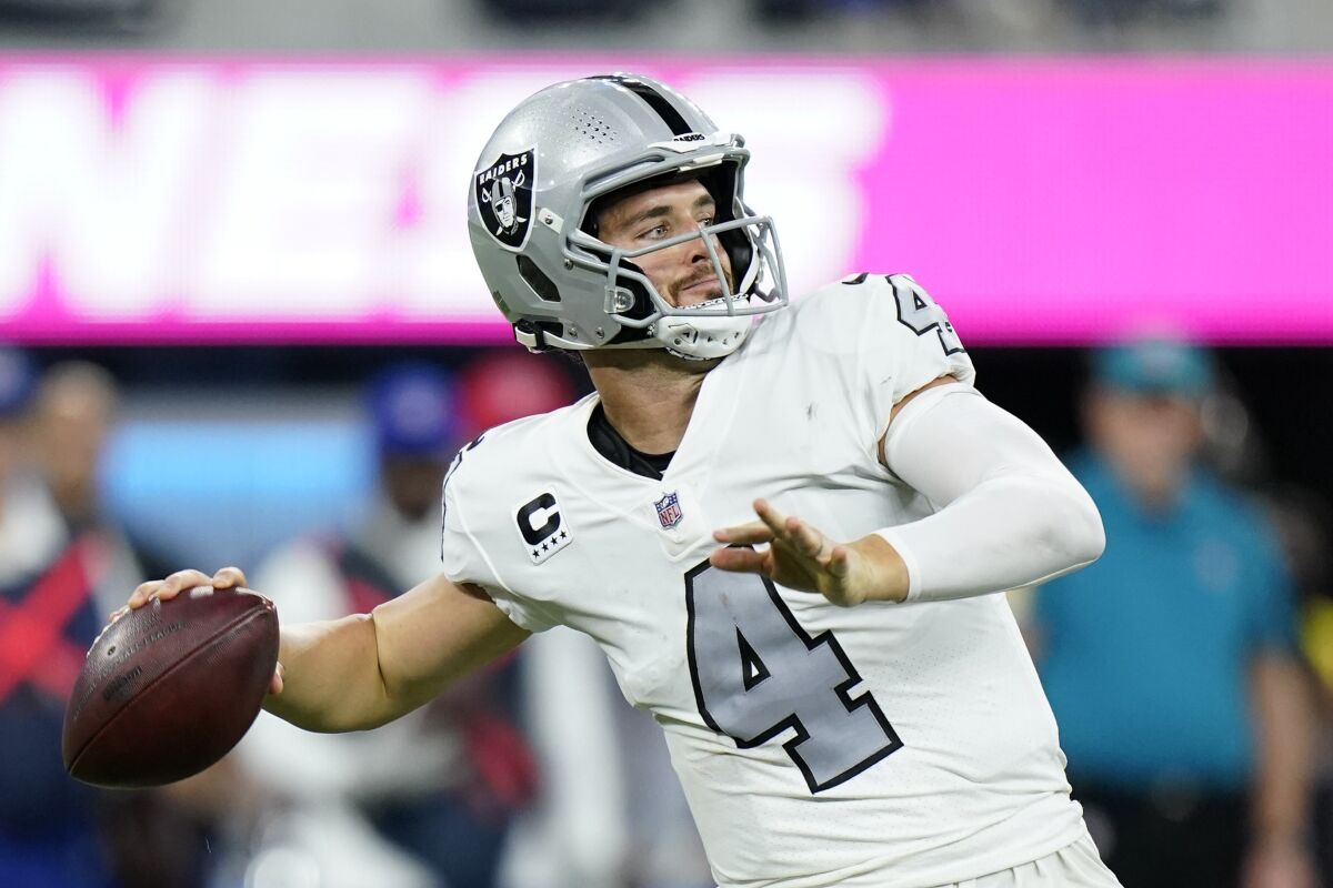 Las Vegas Raiders quarterback Derek Carr throws a pass during the second half of an NFL football game against the Los Angeles Chargers, Monday, Oct. 4, 2021, in Inglewood, Calif. (AP Photo/Marcio Jose Sanchez)
