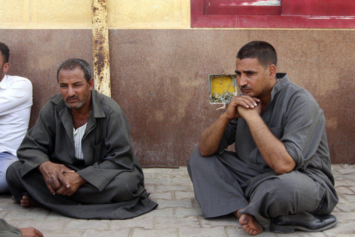 Egyptian relatives of border policeman Ahmed Abd el Hamid, who was among seven soldiers kidnapped last Thursday in northern Sinai, stage a sit-in at the Rafah, Sinai, border crossing between Egypt and the Gaza Strip on Sunday.