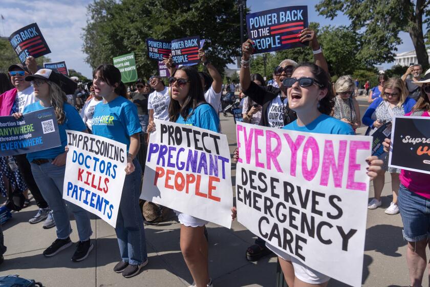 Demonstrators gather outside the Supreme Court on Friday, June 28, 2024, in Washington. (AP Photo/Mark Schiefelbein)