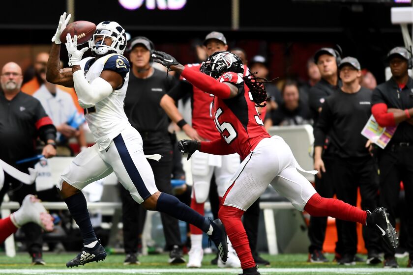ATLANTA, GEORGIA OCTOBER 20, 2019-Rams tight end Gerald Everett makes a catch in front of Falcons safety Jamal Carter in the 3rd quarter at Mercedez Benz Stadium in Atlanta Sunday. (Wally Skalij/Los Angeles Times)