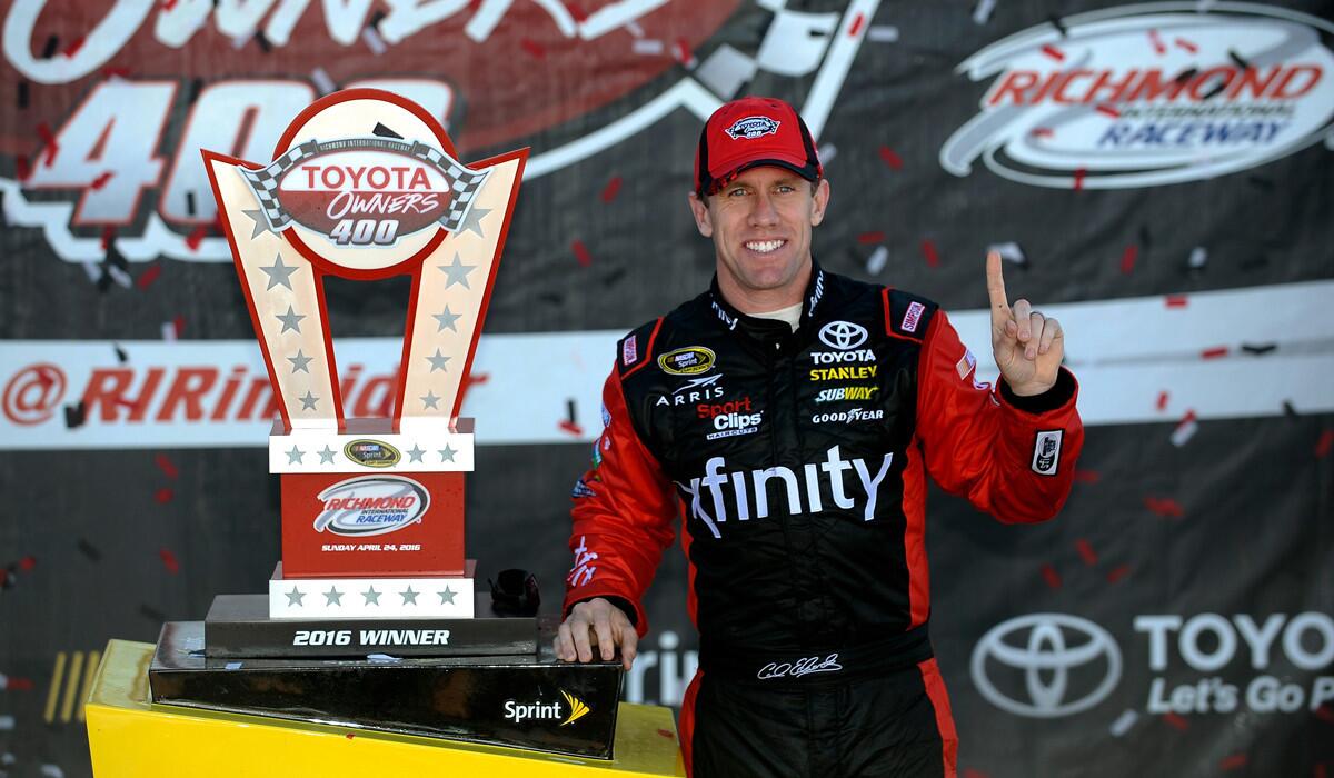 Carl Edwards poses for a photo in Victory Lane after winng the NASCAR Sprint Cup Series TOYOTA OWNERS 400 at Richmond International Raceway on Sunday.