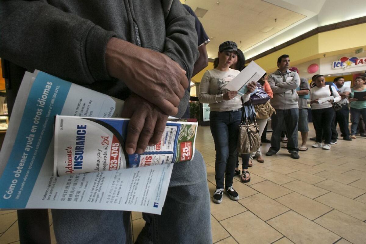 The surge is happening: Customers line up in Panorama City over the weekend to sign up for Obamacare.