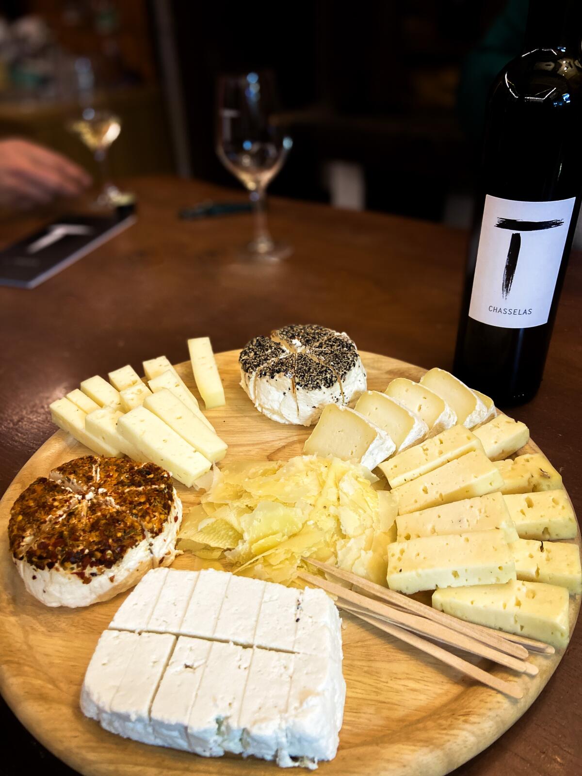 Sampling house wines and local cheeses at Cave le Tambourin Winery.