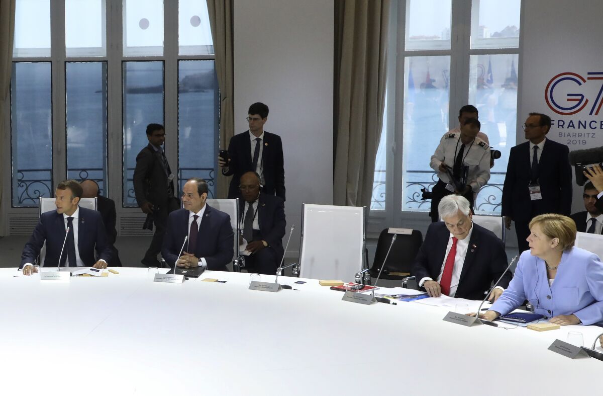President Trump's seat was left empty when he skipped a meeting on combating climate change at the annual G7 summit on Monday.