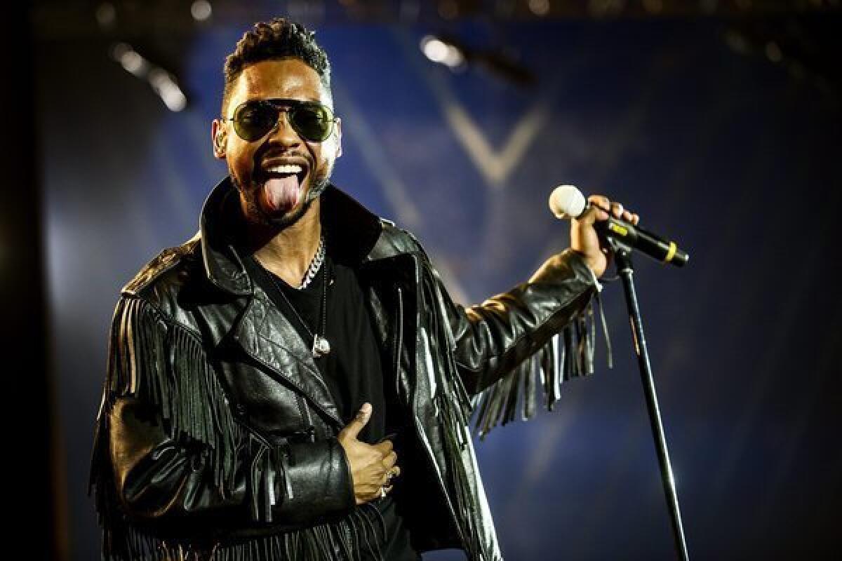 R&B; singer Miguel, shown performing on at the Roskilde music festival last month, was arrested early Monday morning in Marina del Rey.