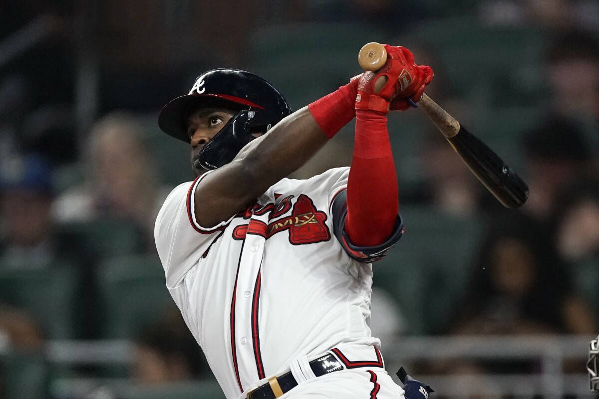 Atlanta Braves' Guillermo Heredia watches his home run in the seventh inning of the team's baseball game against the Oakland Athletics on Tuesday, June 7, 2022, in Atlanta. (AP Photo/John Bazemore)