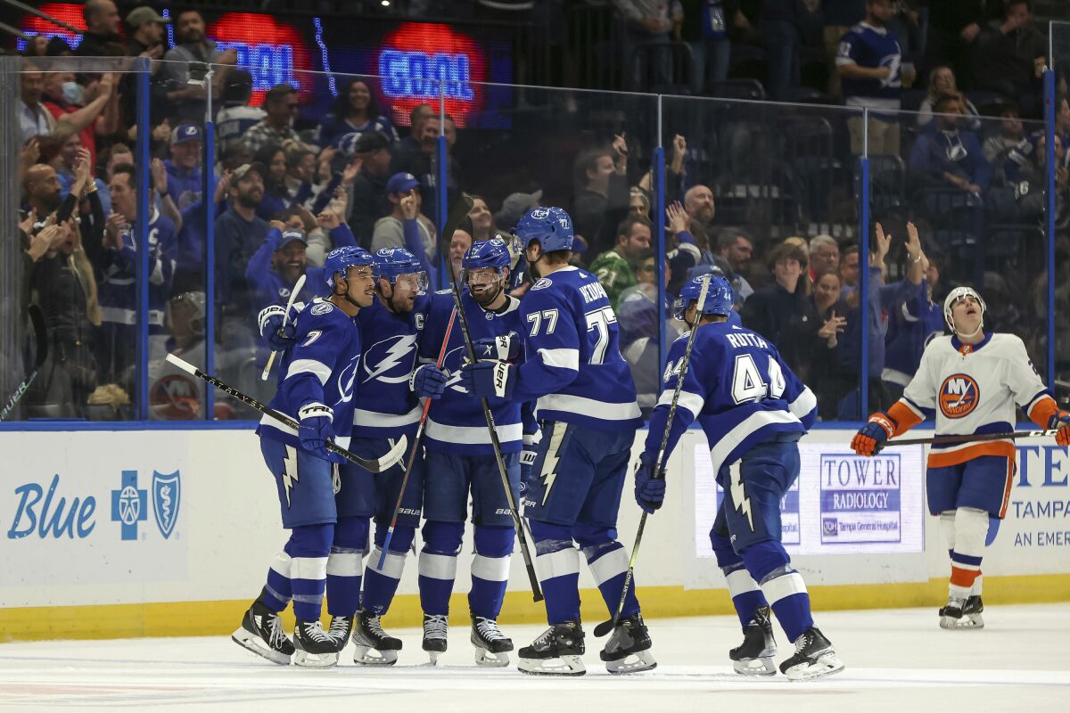 Tampa Bay Lightning's Mathieu Joseph (7) celebrates his goal against the New York Islanders with Steven Stamkos, Alex Killorn, Victor Hedman and Jan Rutta during the first period of an NHL hockey game Monday, Nov. 15, 2021, in Tampa, Fla. (AP Photo/Mike Carlson)