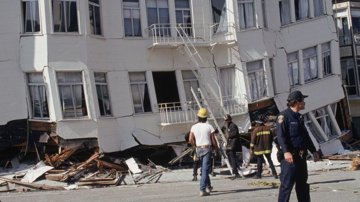 The lowest story of a San Francisco apartment building is crushed by the upper floors after the magnitude 6.9 Loma Prieta earthquake in 1989.