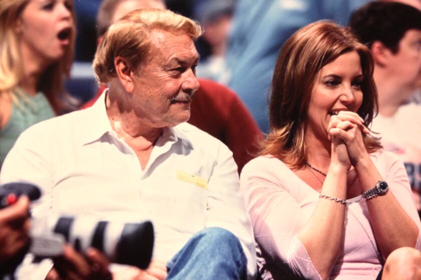 Jerry with Jeanie Buss the daughter Jeanie, the team's executive vice president of business operations and engaged to former Laker Coach Phil Jackson. Courtesy Buss family.