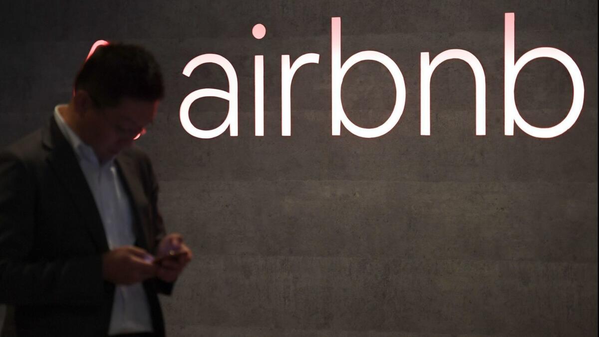 The rental site Airbnb logo displayed during the company's press conference in Tokyo earlier this month.