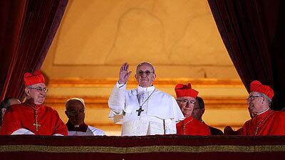 Newly elected Pope Francis I appears on the central balcony of St Peter's Basilica in Vatican City.