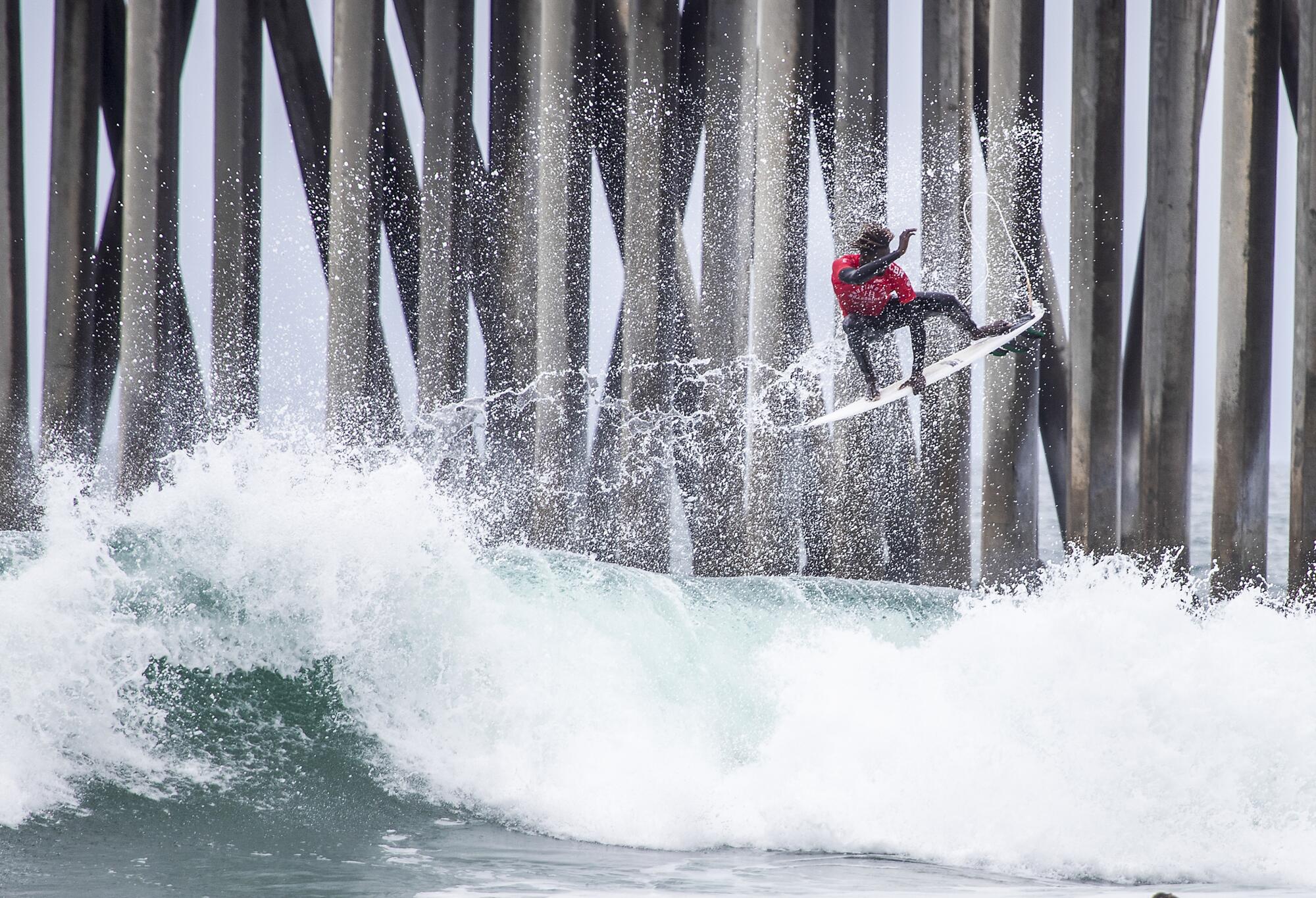 Cherif Fall, surf champion of Senegal, goes airborne off a big wave.