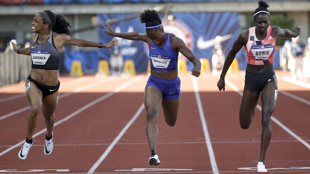 English Gardner, left, beats out runner up Tianna Bartoletta and third-place Tori Bowie in the 100-meter final during the U.S. Olympic track and field trials on July 3.