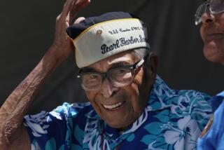 August 13, 2017 San Diego, CA. USA | Pearl Harbor Survivor Ray Chavez puts his cap back on after the invocation on Sunday. On Sunday, hundreds gathered at the Veterans Museum at Balboa Park for the annual Sprit of '45 Day; a national day of remembrance to real the victory celebrations at the end of WWII on August 14, 1945. This is the 72nd anniversary and is celebrated on the second Sunday of August. Dozens of WWII veterans and their families were joined by re-enactors, local girl and boy scouts and current members of the military for the celebration. The American Flyboys Orchestra provided the musical entertainment. | Photo credit: Peggy Peattie