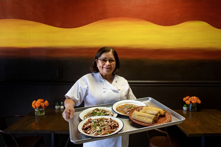 INDIO, CA - NOVEMBER 18, 2022: Silvia Rendon owner of Casa de Silvia restaurant shows off her Mexican dishes including her award winning tamales on November 18, 2022 in Indio, California. She has accumulated many trophies from the Indio Tamale Festival which is celebrating its 30th anniversary in early December. (Gina Ferazzi / Los Angeles Times)