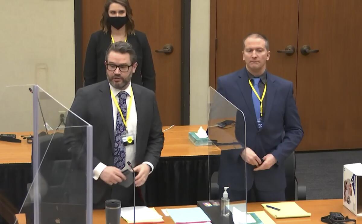 Eric Nelson, Amy Voss and Derek Chauvin stand in court.