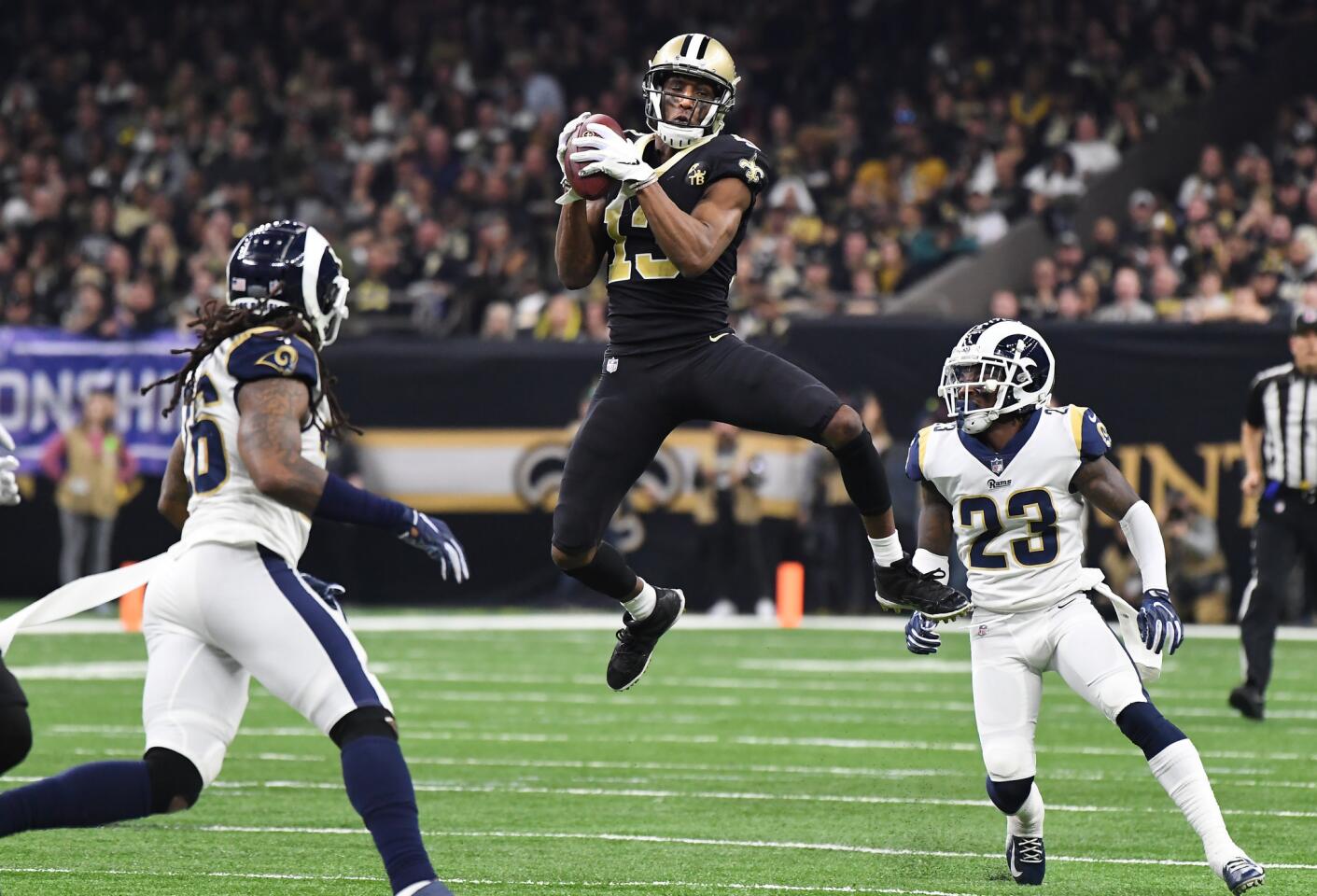 New Orleans Saints receiver receiver Michael Thomas makes a catch in fornt of Rams' Nickell Robey-Coleman (23) in the third quarter in the NFC Championship at the Superdome in New Orleans Sunday.