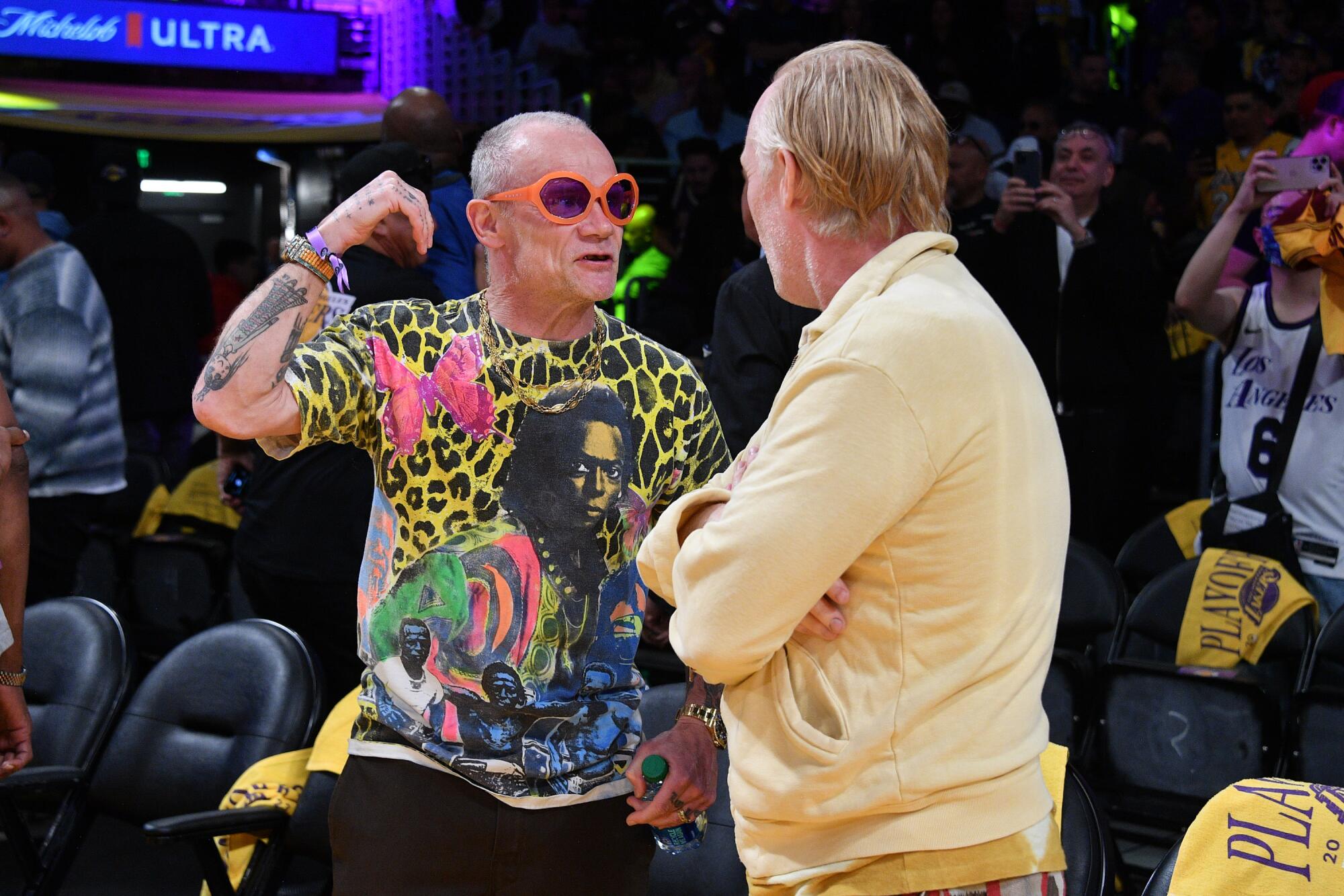 Musician Flea attends a basketball game.