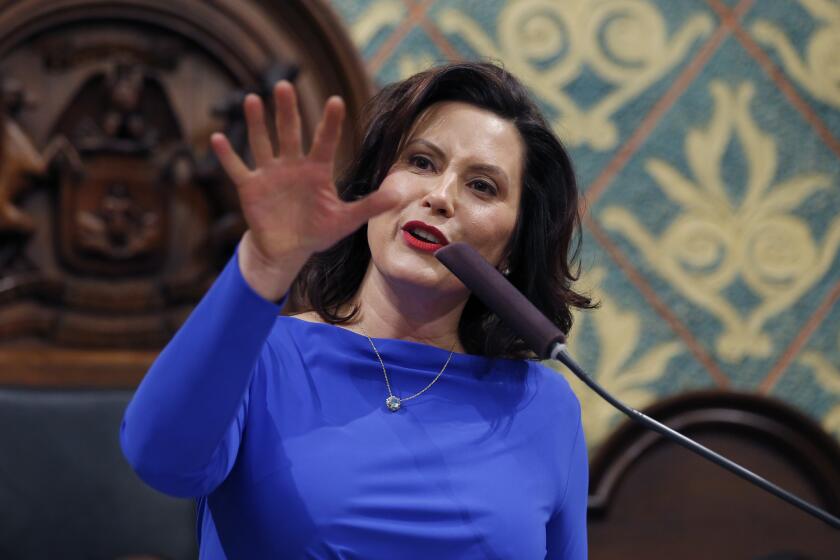 FILE - Ion this Feb. 12, 2019 file photo, Michigan Gov. Gretchen Whitmer delivers her State of the State address to a joint session of the House and Senate at the state Capitol in Lansing, Mich. Whitmer wants to spend billions more to fix the roads and boost a lagging education system. But as the Democrat prepares to deliver her first budget proposal to the Republican-led Legislature, she faces fiscal and political pressures that are complicating her task. She notes the general fund has not grown much. The budget is Whitmer's chance to detail how she plans to "fix the damn roads" and pay for priorities like letting high school graduates attend community college for free. (AP Photo/Al Goldis, File)