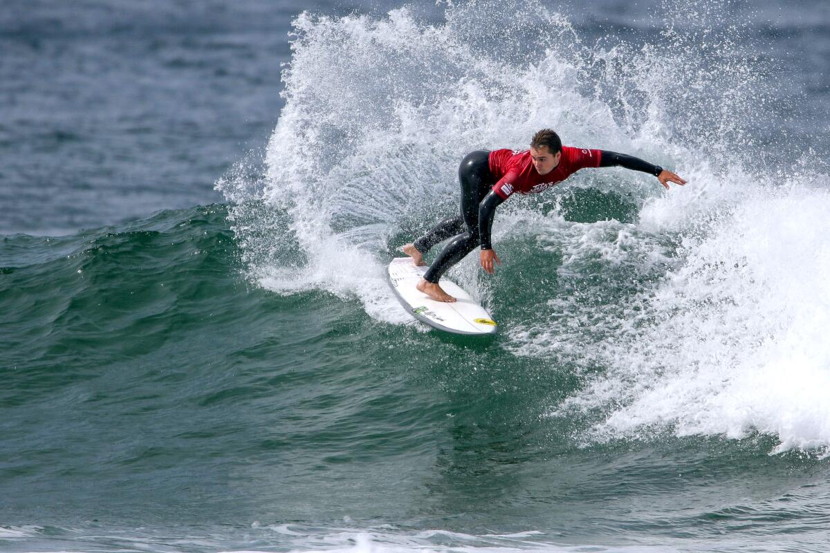 Newport Beach's Tyler Gunter surfs in heat one of the quarterfinals of the Jack's Surfboards Pro in Huntington Beach.