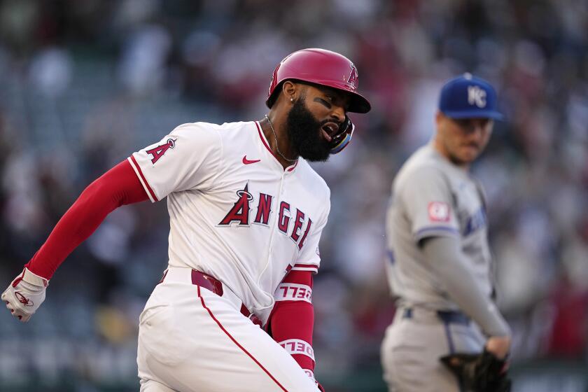 The Angels' Jo Adell celebrates as he rounds first after hitting a three-run home run 