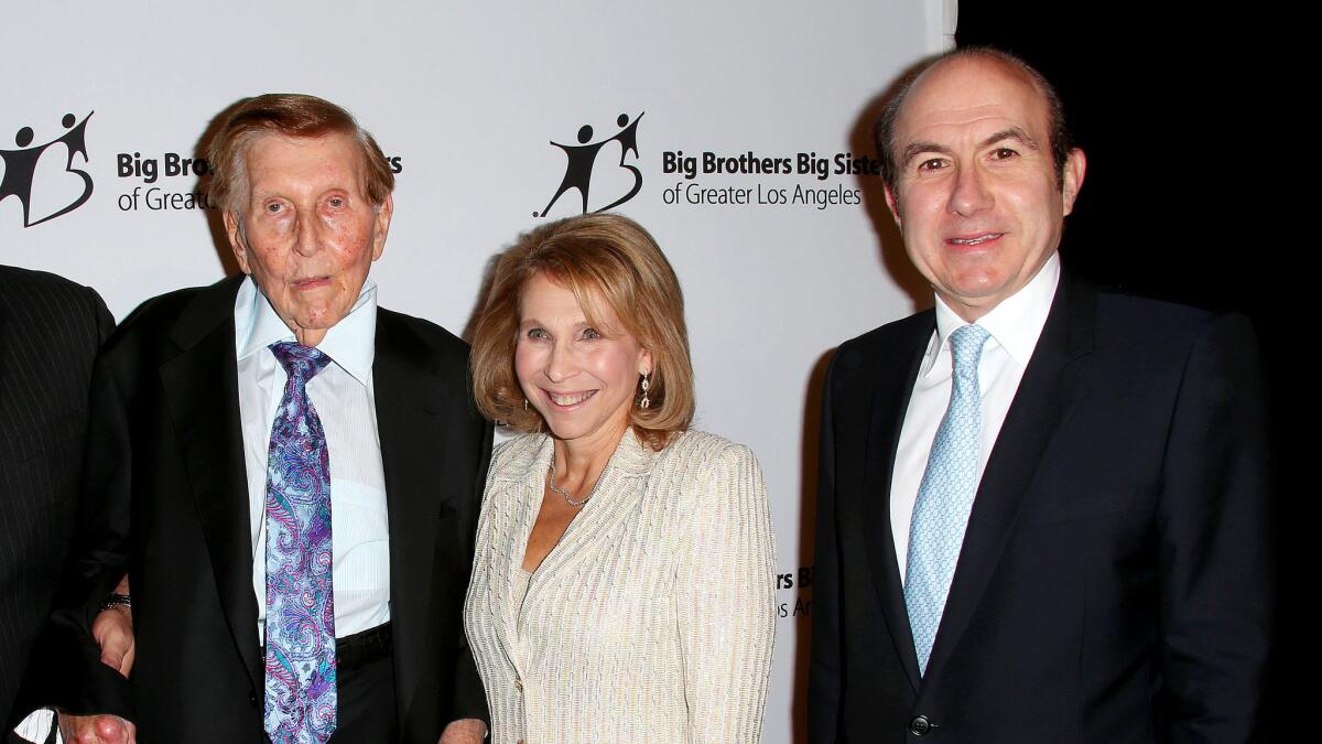 Sumner Redstone's former companion, Manuela Herzer, filed a motion Monday, seeking a new trial. Pictured in 2012: Sumner Redstone, his daughter, Shari Redstone who is vice chair of Viacom, and Viacom Chief Executive Philippe Dauman.