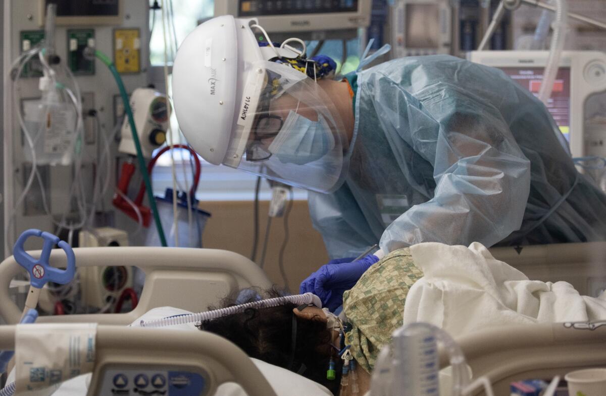 Registered nurse Ashley Cohagen treats a patient