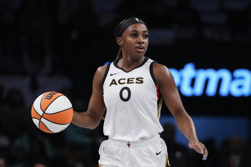 FILE - Las Vegas Aces' Jackie Young (0) brings the ball down the court during the first half in Game 3 of a WNBA basketball final playoff series against the New York Liberty, Sunday, Oct. 15, 2023, in New York. The Aces signed guard Young to contract extension through 2025, the team announced Saturday, May 4, 2024. (AP Photo/Frank Franklin II, File)