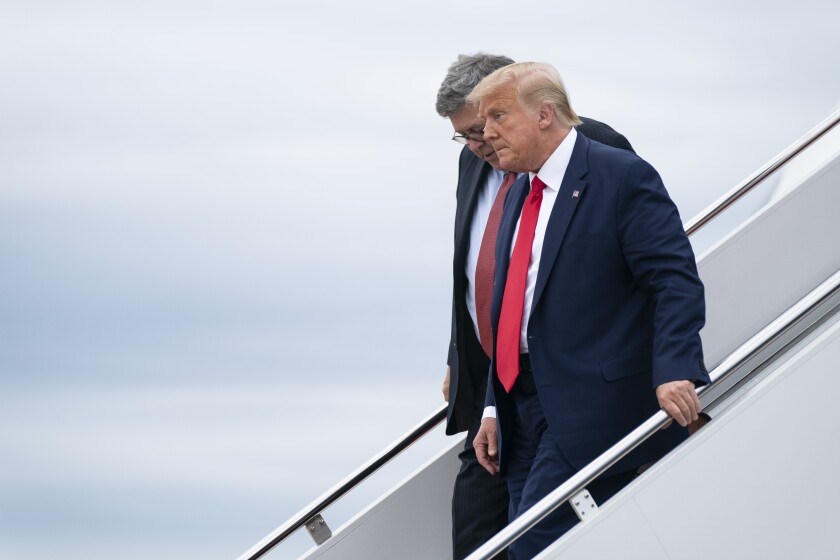 President Donald Trump and Attorney General William Barr arrive at Andrews Air Force Base after a trip to Kenosha, Wis., Tuesday, Sept. 1, 2020, at Andrews Air Force Base, Md. (AP Photo/Evan Vucci)