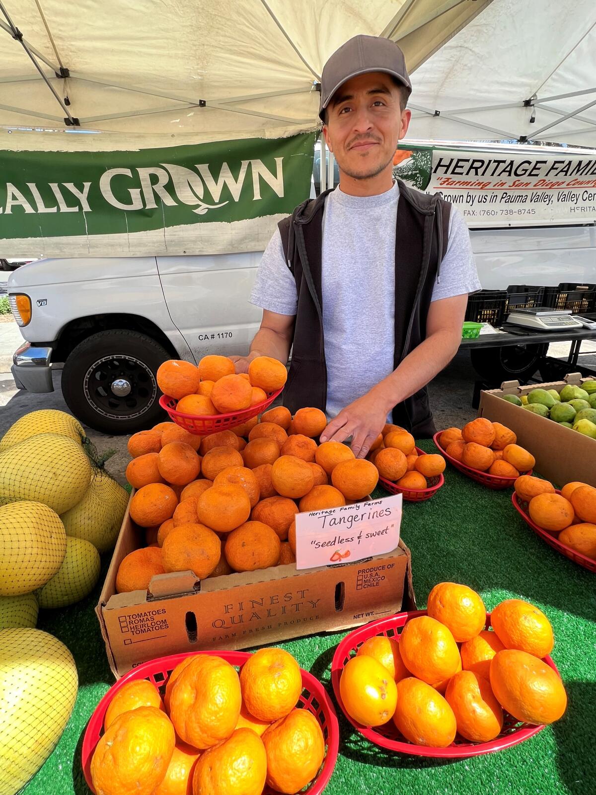 Carmelo Martinez of Heritage Family Farm with some of the citrus and avocados he brought to the PB Farmers Market.