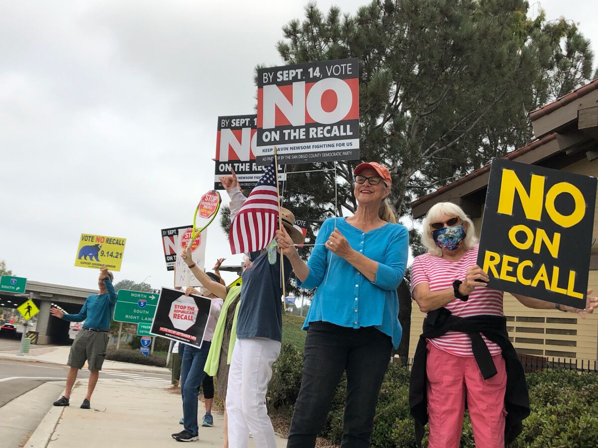 Tina Zucker and Jill Cooper were among the local residents who held a demonstration in support of Gov. Gavin Newsom.