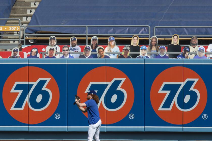 Los Angeles Dodgers starting pitcher Dustin May warms up before a baseball game against the Los Angeles Angels in Los Angeles, Sunday, Sept. 27, 2020. (AP Photo/Kyusung Gong)