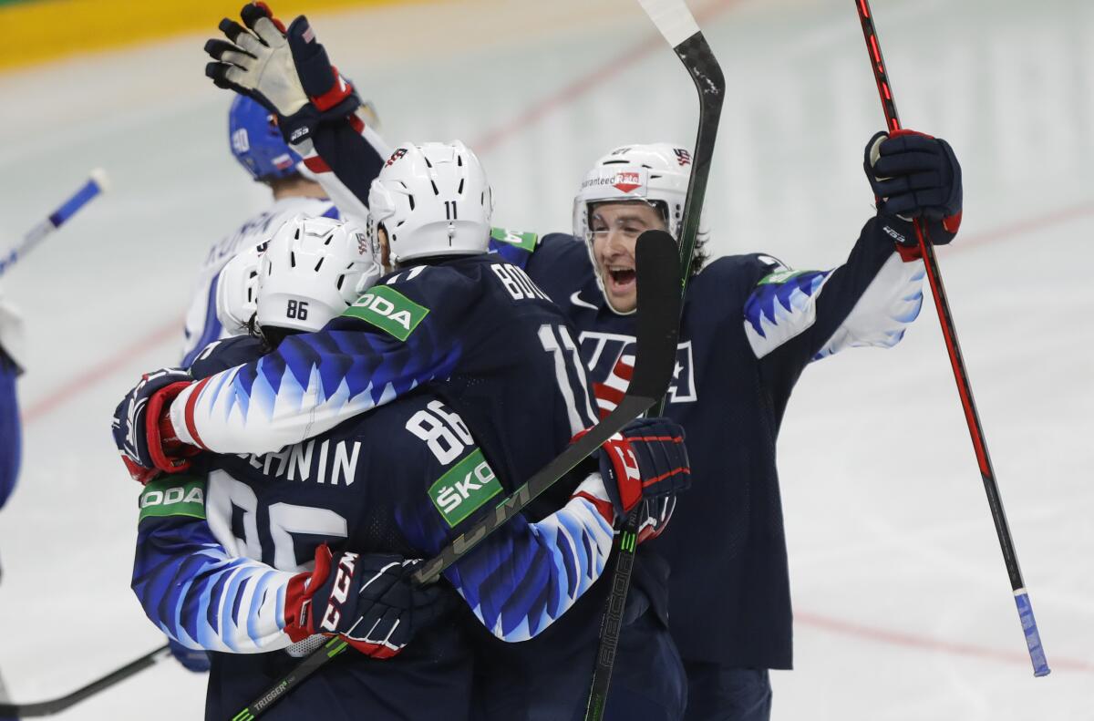 US players celebrate after scoring their side's fifth goal during the Ice Hockey World Championship quarterfinal match between the United States and Slovakia at the Arena in Riga, Latvia, Thursday, June 3, 2021.(AP Photo/Sergei Grits)