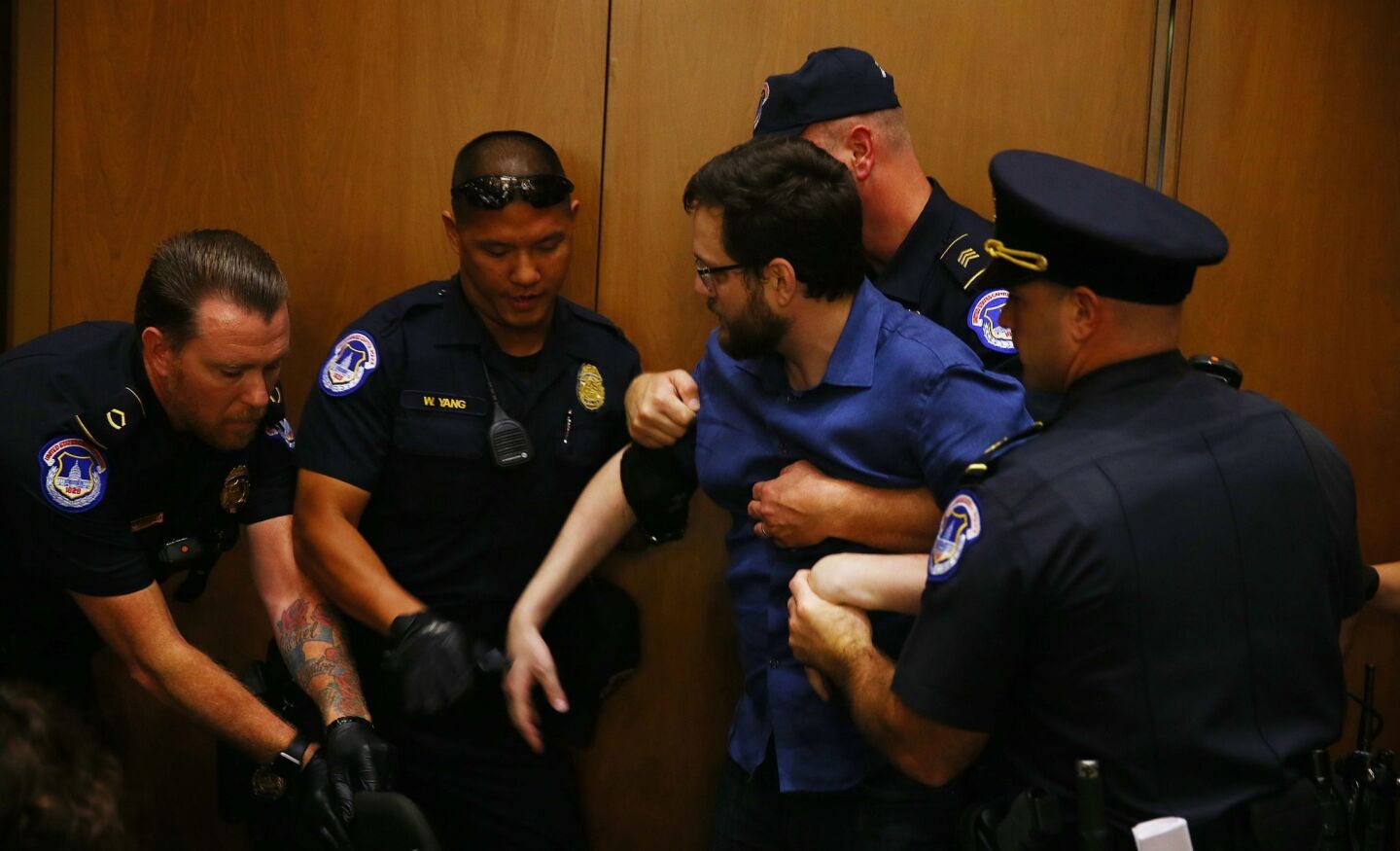 A protester is removed as Judge Brett Kavanaugh appears before his Senate confirmation hearing.