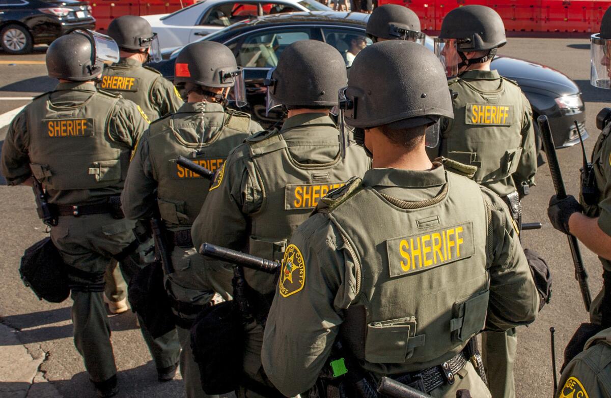 Orange County sheriff's deputies in riot gear 