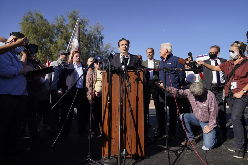 Former Nevada Attorney General Adam Laxalt speaks during a news conference in front of the Clark County Election Department, Thursday, Nov. 5, 2020, in Las Vegas. (AP Photo/John Locher)