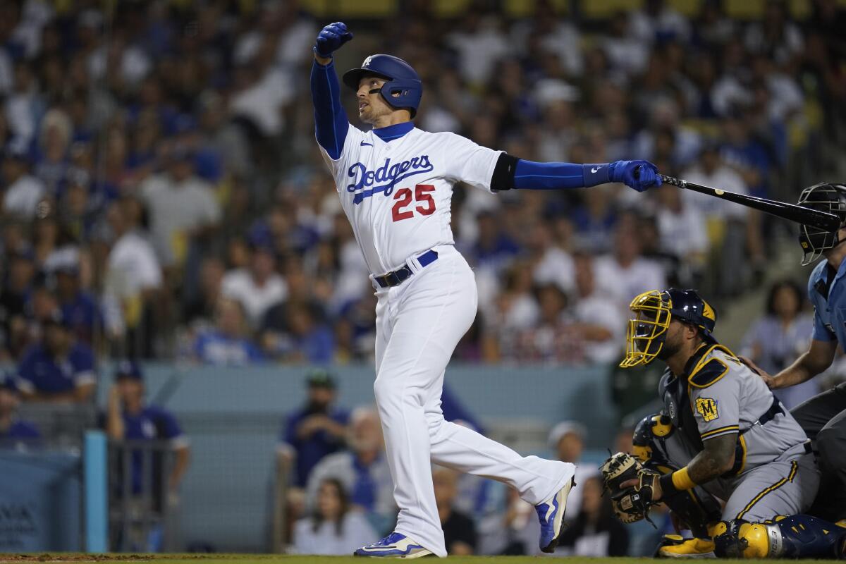 Dodgers designated hitter Trayce Thompson hits a home run.