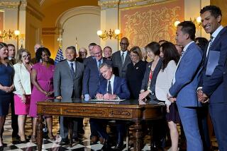 California Gov. Gavin Newsom signs legislation at the state Capitol on Monday, Oct. 14, 2024, aimed at preventing gas prices from spiking at the pump. (AP Photo/Sophie Austin)