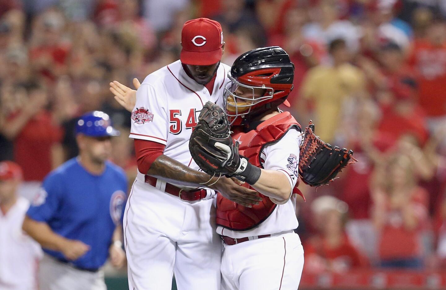 Aroldis Chapman and Tucker Barnhart celebrate after the 5-4 win over the Cubs.