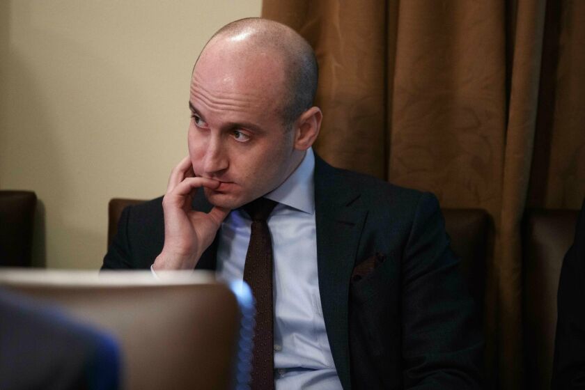 FILE- In this Jan. 2, 2019, file photo White House senior adviser Stephen Miller listens as President Donald Trump speaks during a cabinet meeting at the White House in Washington. Miller indicated Sunday, Feb. 17, on "Fox News Sunday" that Trump is prepared to issue the first veto of his term if Congress votes to disapprove of his declaration of a national emergency along the U.S.-Mexico border. (AP Photo/Evan Vucci, File)