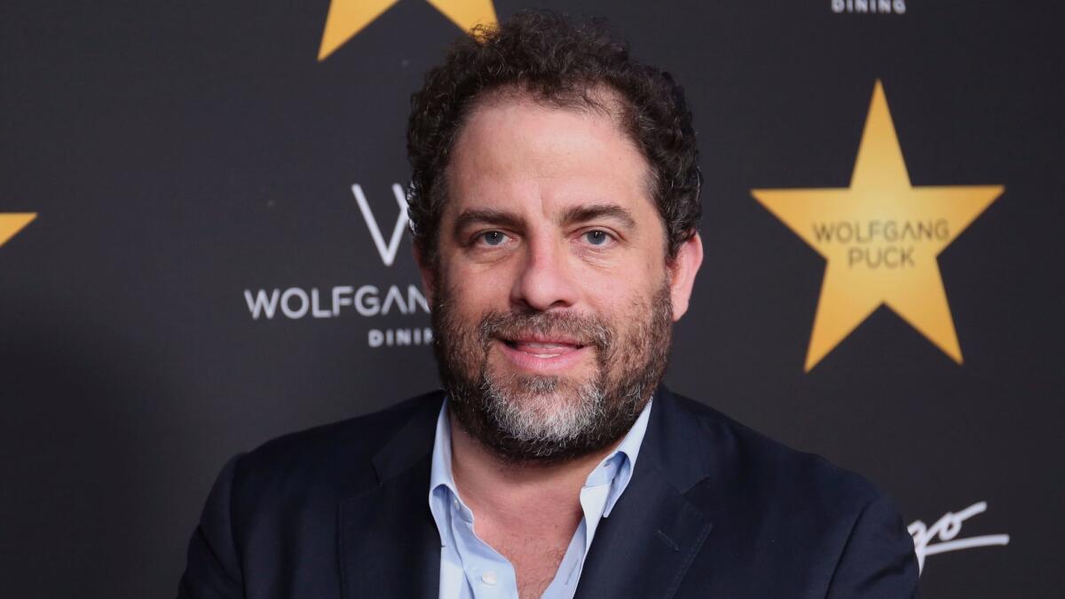 Beverly Hills police investigated filmmaker Brett Ratner, shown, and music mogul Russell Simmons for alleged sexual battery in 2001, but no charges were filed.
