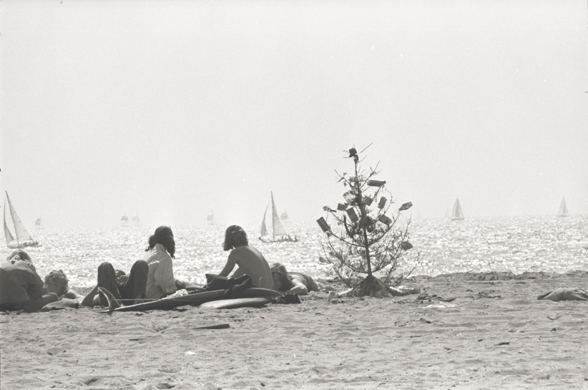 March 26, 1973: Children sit next to a discarded Christmas tree they decorated with beach trash in Marina del Rey, Calif.