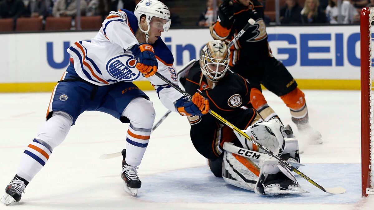 Oilers center Connor McDavid scores against Ducks goalie Jonathan Bernier during a game this season.