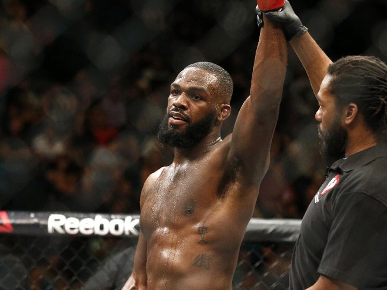 Jon Jones celebrates after defeating Ovince St. Preux during an interim light-heavyweight championship bout at UFC 197 on April 23.