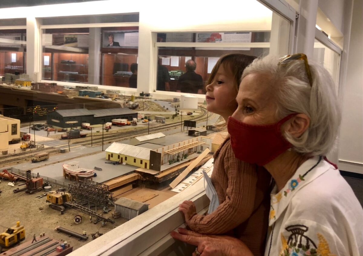 Debra Shaiken of Carlsbad takes her grandson Mylo to the San Diego Model Railroad Museum at Balboa Park on Saturday.