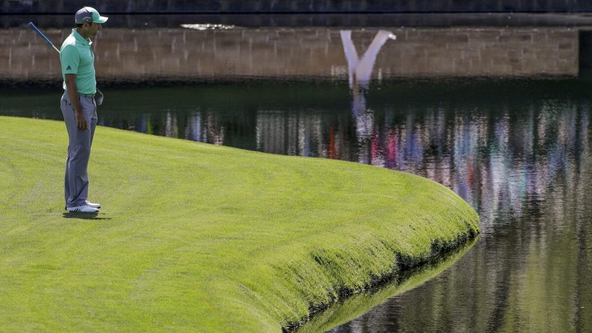 Sergio Garcia looks over the water on the 15th hole during the first round at the Masters.